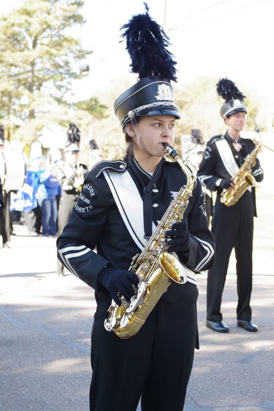 Student playing the saxophone in the band